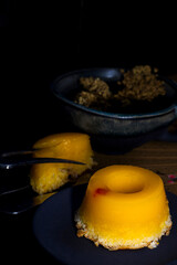 Traditional Brazilian dessert - quindim, originally from Portugal, prepared with sugar, egg yolk and coconut