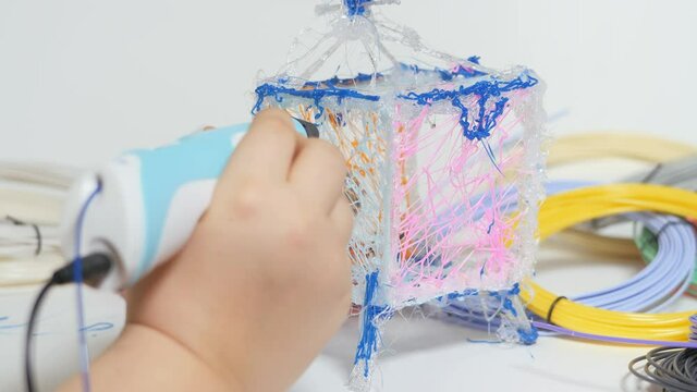 3D pen in a child's hand.
