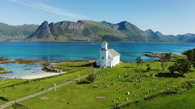 Flying around Gimsoy Church in Gimsoysand village, Lofoten islands, Norway