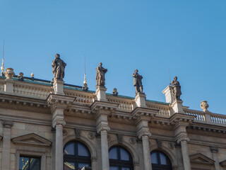 Fototapeta na wymiar Statues on the facade of a building in Prague