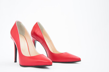 High-heeled shoes in red. Sexy shoes. White background. There is space for text