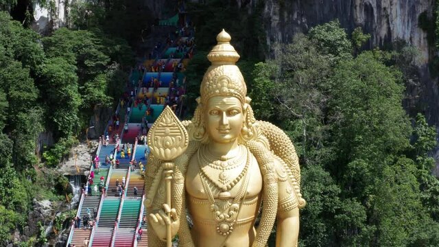 Flight over scenic Lord Murugan Statue  (Batu caves)