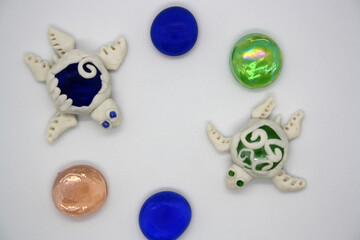 A turtle made of polymer clay on a white background.