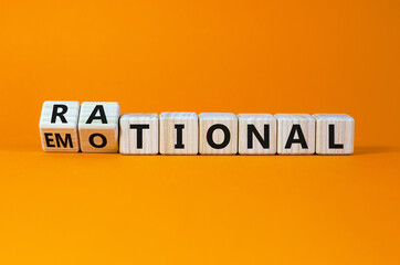 Rational or emotional symbol. Turned wooden cubes and changed the word 'rational' to 'emotional'. Beautiful orange background. Psychological and rational or emotional concept. Copy space. - obrazy, fototapety, plakaty
