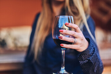 Woman having a wine on a terrace