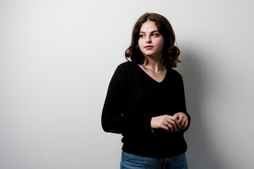 Obraz premium Young woman student on white background. Attractive girl teacher explain rules in english class. Education in university. Foreign school private study with a school girl.