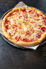 pepperoni pizza meat salami sausage double cheese fast food Takeaway on the table meal snack top view copy space for text food background rustic