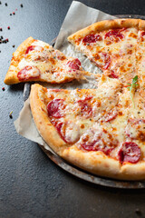 pepperoni pizza meat salami sausage double cheese fast food Takeaway on the table meal snack top view copy space for text food background rustic