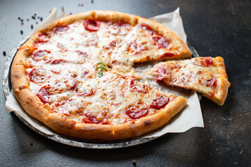 pepperoni pizza meat salami sausage double cheese fast food Takeaway on the table meal snack top view copy space for text food background rustic