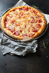 pepperoni pizza meat salami sausage double cheese fast food Takeaway on the table meal snack top view copy space for text food background rustic