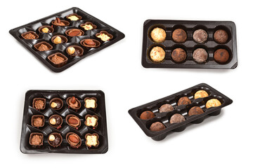 Chocolate candy collection in plastic box.