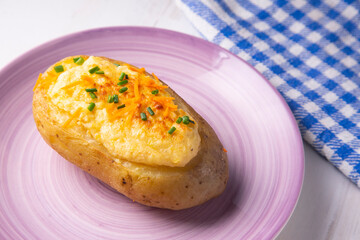 Stuffed grilled potatoes with bechamel and cheese