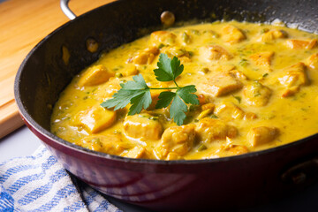 Chicken cooked with coconut milk and curry.