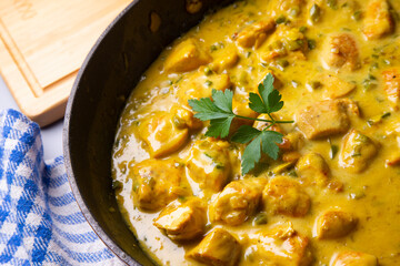 Chicken cooked with coconut milk and curry.