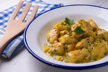 Chicken cooked with coconut milk and curry.