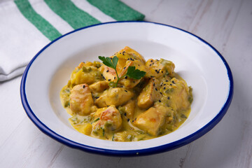 Chicken cooked with coconut milk and curry.