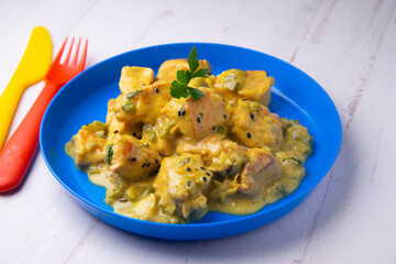 Chicken cooked with coconut milk and curry.