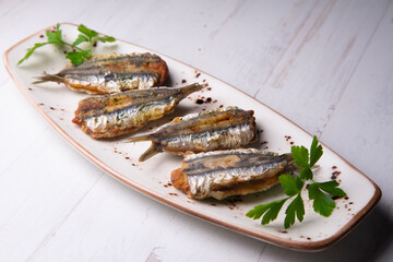 Traditional spanish tapa: Boquerones rellenos de málaga con perejil.