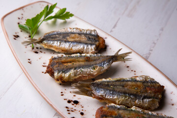 Traditional spanish tapa: Boquerones rellenos de málaga con perejil.