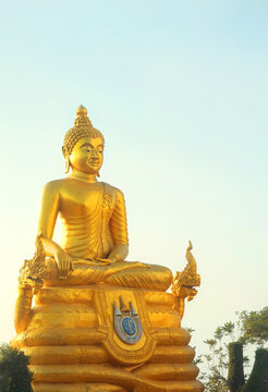 Golden Buddha statue against sky background. religion art national concept. Buddhism culture symbol on Phuket island, Thailand. relax spiritual travel