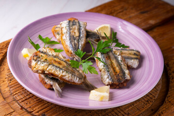 Traditional spanish tapa: Boquerones rellenos de málaga con perejil.