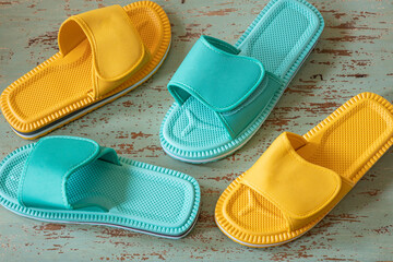 Variously colored flip-flops for walking on the house or the beach. Stylish Design of different...
