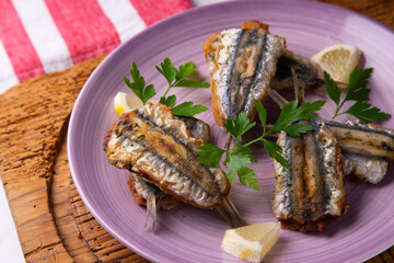 Traditional spanish tapa: Boquerones rellenos de málaga con perejil.