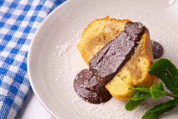 Coffee cake traditional spanish recipe with chocolate on the top.