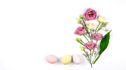 Easter composition. Easter eggs, flowers, paper blank on white background. Flat lay, top view, copy space, mock up.
