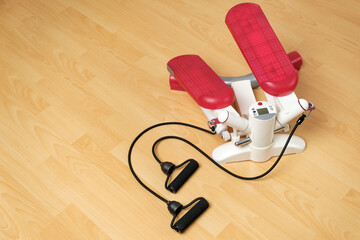 Fitness stepper or cardio training with digital display on the floor. Workout at home during...
