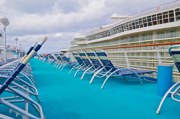 Pooldeck or swimmingpool with outdoor sun deck on modern classic cruiseship or cruise ship liner...