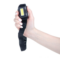 Head torch flashlight in hand on white background isolation