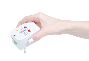 Travel universal adapter in hand on white background isolation