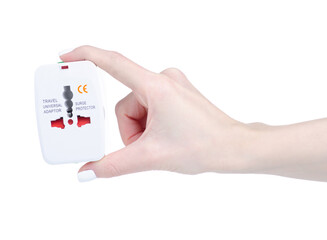 Travel universal adapter in hand on white background isolation