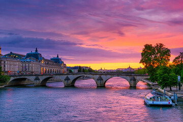 Sunset view of Seine river, Pont Royal and Orsay Museum (Musee d'Orsay) in Paris, France