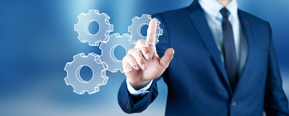 man touching technology interface with gear