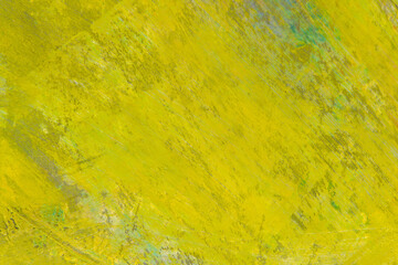 colorful creative motley background: smudged residues of oil paints on a wooden palette, short focus, selective blur