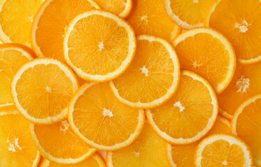 Abstract background of orange citrus slices on white.