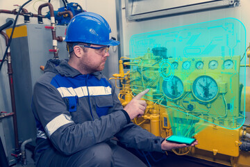 Electromechanic performs repair work on a diesel generator