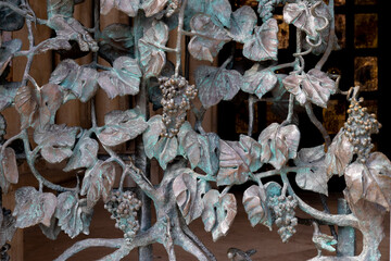 wrought-iron grille showing the vines, Pecs, HUngary
