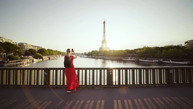 woman in red, whith phone and Eiffel tower, Paris