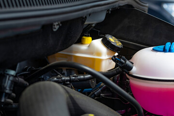 Natural light. under the hood is a tank with brake fluid. Inspection, replacement and maintenance...