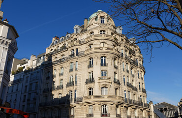 Fototapeta na wymiar Traditional French house with typical balconies and windows. Paris .