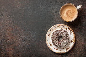 Cup of coffee and chocolate donut