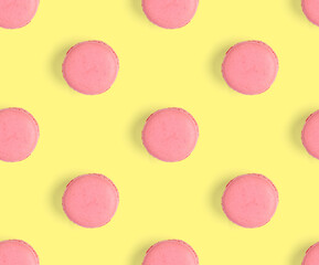 macarons seamless pattern. macarons isolated on yellow background.