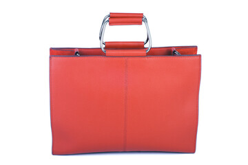 red fashionable female bag made of genuine leather on a white background isolate