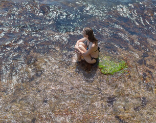 Thin slim female person at the sea
