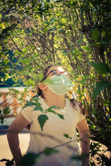 selective approach girl looking through branches