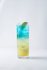 isolated glass with ice and lime