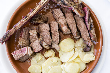 plate with beef cutlet and legs before eating